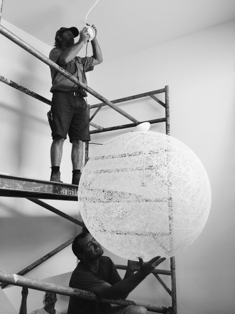 Emanate electrical trades people installing new lighting.